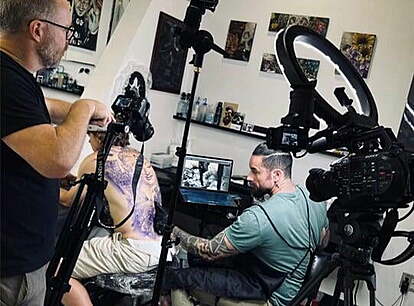 In-progress back tattoo process of Charles Huurman